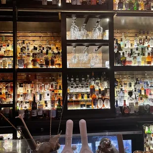 a bar filled with liquor bottles