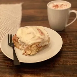 a plate of food and a cup of coffee
