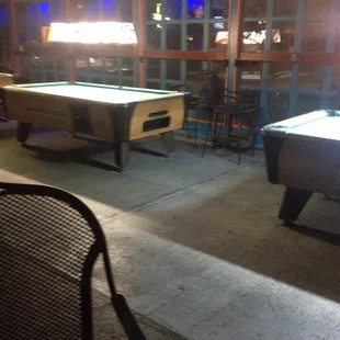 Several pool tables coin operated.