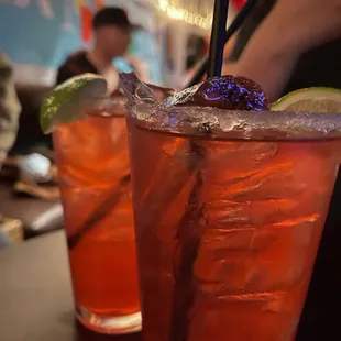 a close up of two cocktails