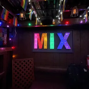 a bar with a neon sign