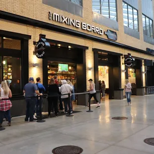 a group of people standing outside of a building