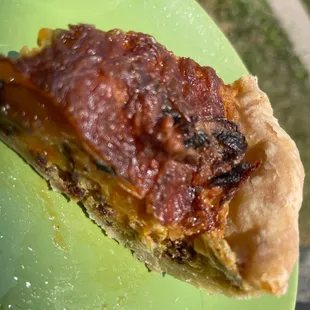 a piece of pie on a green plate