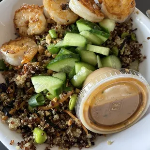 Asian Shrimp Bowl. Perfectly grilled shrimp, cucumbers, edamame, quinoa, and peanut sauce on the side. FABULOUS!