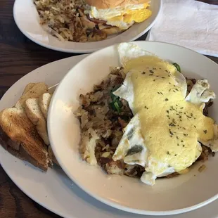 Mediterranean skillet with toast. (Breakfast sandwich with side of hash browns featured in background)