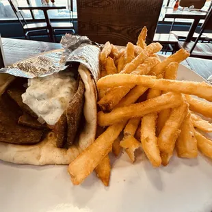 a plate of fries and a sandwich