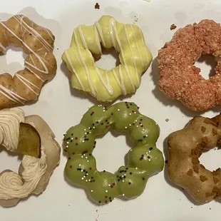 Earl grey lavender honey, yuzu, strawberry crunch, Japanese sweet potato, matcha sprinkle, and gingerbread mochi donuts