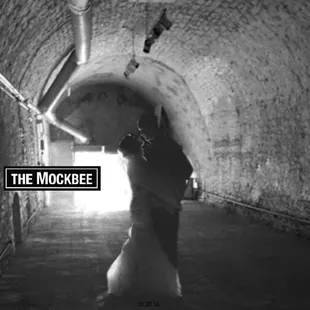 a man walking through a tunnel