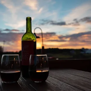 a bottle of wine and two glasses of wine