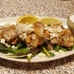 Greek wings with lemon and feta cheese.