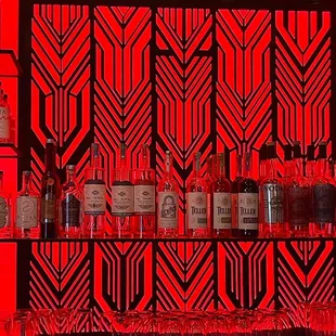 a bar with liquor bottles and wine glasses