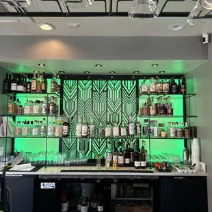 a bar with green lights