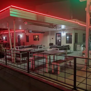 Neon-lit outdoor lounge at Momo