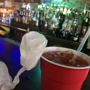 Napkin rose, delicious hurricane, bar