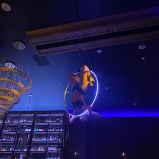 a man suspended from the ceiling