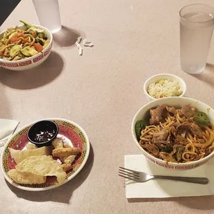 ows two plates of food on a table