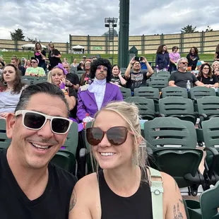 a man and a woman at a baseball game