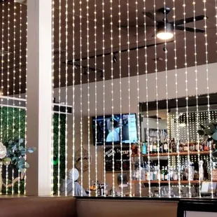 Bead divider between bar &amp; dinner area.