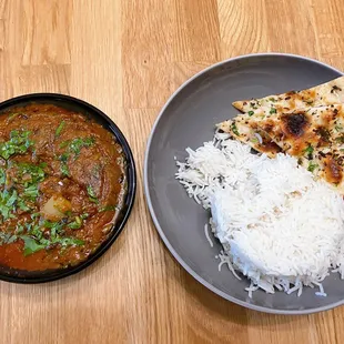 Goat masala Togo with garlic naan