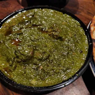 Saag with goat, very tasty but beware of bones