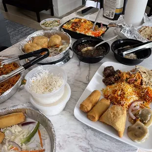 Samosas, spring rolls, garlic naan, Dynamite Gobi Biryani, Momos. Everything was tasty and will order again!