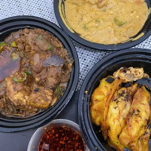 Chicken Chettinad (yellow curry), chicken kadai, and chicken tandoor momo (dumpling)