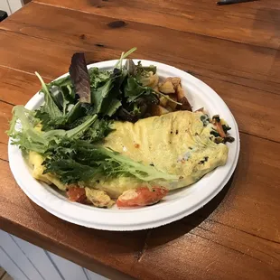 Sunday brunch with just the right amount of decedent homestyle home-fries tucked between the omelet and the fresh salad.