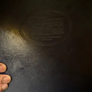 a person&apos;s foot on a black table