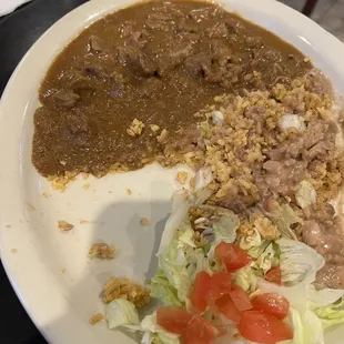 Carne guisada plate with half of it eaten already before I took the pic.