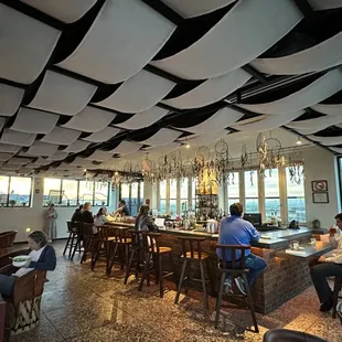 a restaurant with a view of the ocean