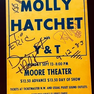 a poster for the motley hatchet show