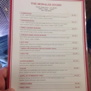 a person holding a menu