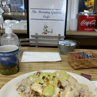 Biscuit gravy with chorizo and over easy eggs and green creamy salsa!!! So good!! Best biscuit gravy bar none!!