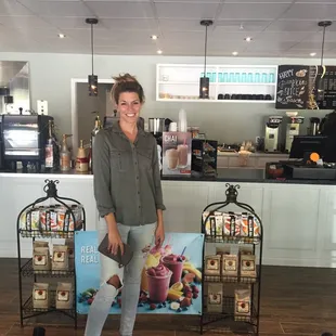 a woman standing in front of a counter