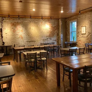 a dining room with tables and chairs