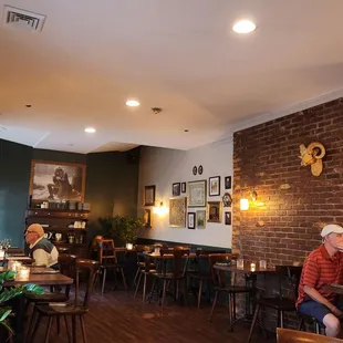 people sitting at tables in the restaurant