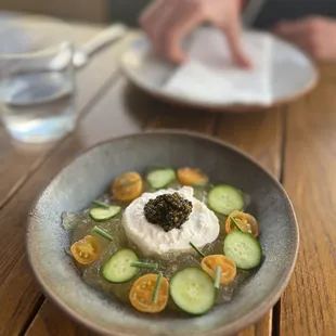 Burrata with caviar, tomato and lime jelly, tomatoes and cucumber