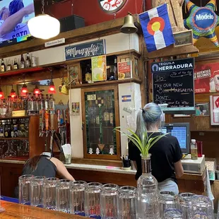 a bar with people at the bar