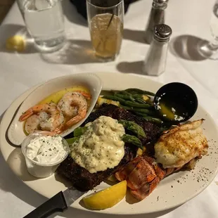 Cowboy Ribeye, shrimp scampi, lobster tail, loaded mashed potatoes, green beans and asparagus.  The Long Island was nice and STRONG