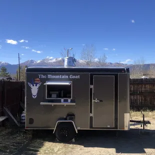 the food truck parked in the yard
