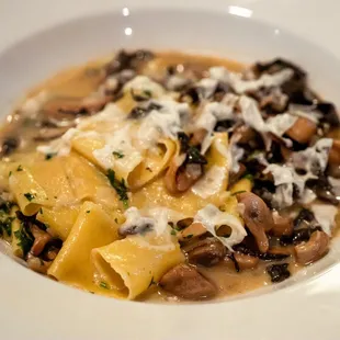 a bowl of pasta and mushrooms