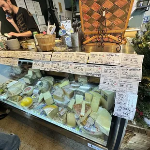 Luca at the cheese counter. What a fun shop!