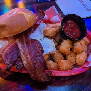 Wake n Bake w/tater tots.  Delicious combo: eggs over easy, bacon, cheese w/bun w/crispy lt taters. Delicious, hearty &amp; generous portions.