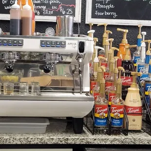 Espresso machine with used, UNCLEANED portafilters just sitting in there until the next order. So gross!