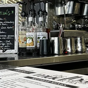 a menu and a coffee maker