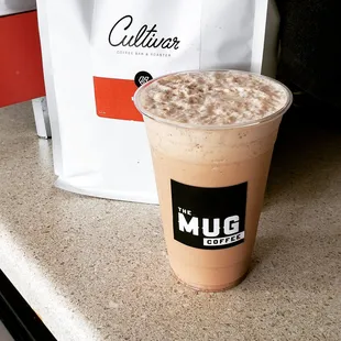 a cup of coffee on a counter