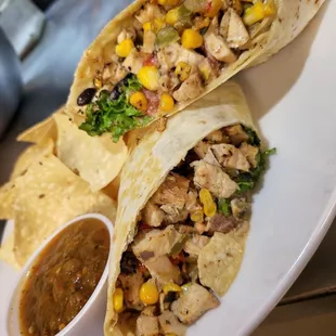 two burritos with a side of salsa