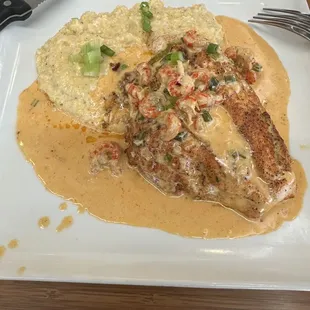 Catfish stuffed with crabmeat and crawfish sauce on top of creamy grits!!!