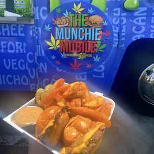 Combo #2 Consist of two single smash sliders, 1 munchie sauce, side of fries.