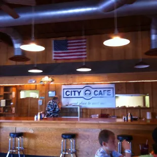 eople sitting at the bar